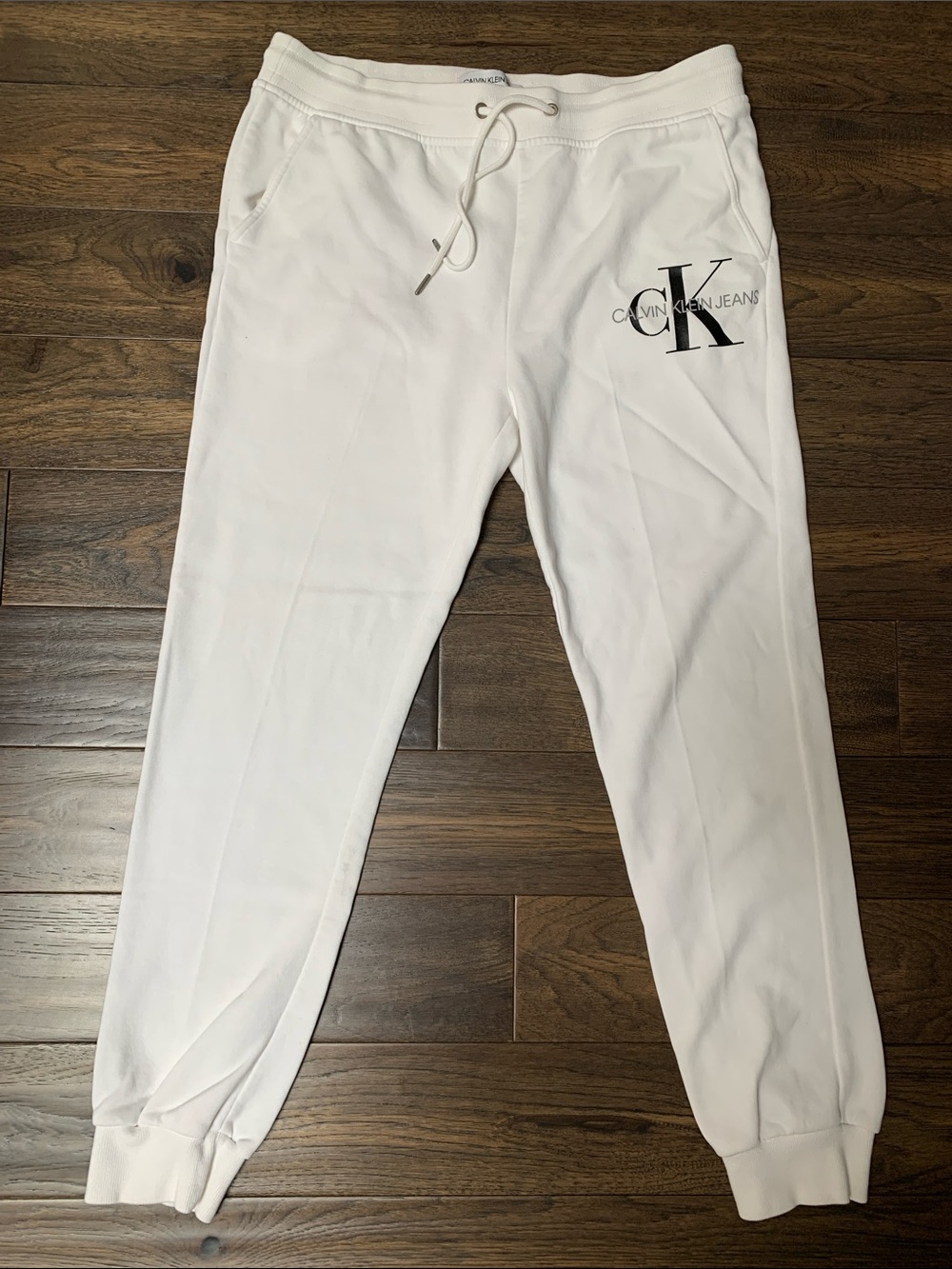 Calvin Klein ElegantWhite Jogger Pants with CK Logo.Pre-Owned excellent.Size:L/G